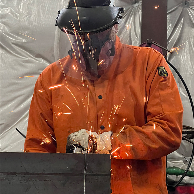 man welding